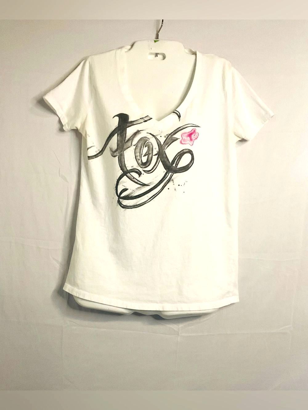 Fox White Short Sleeve V-Neck Tee with Black Script and Pink Accent